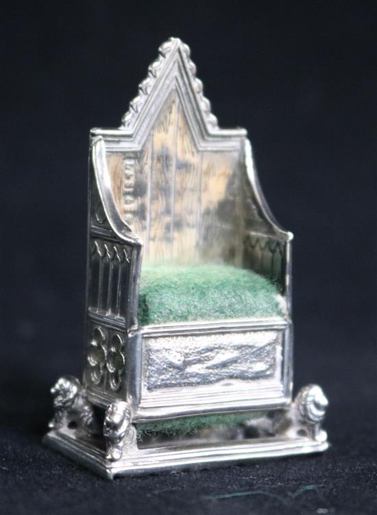 An Edwardian novelty silver pin cushion modelled as a Coronation chair by Levi & Salaman, 48mm.